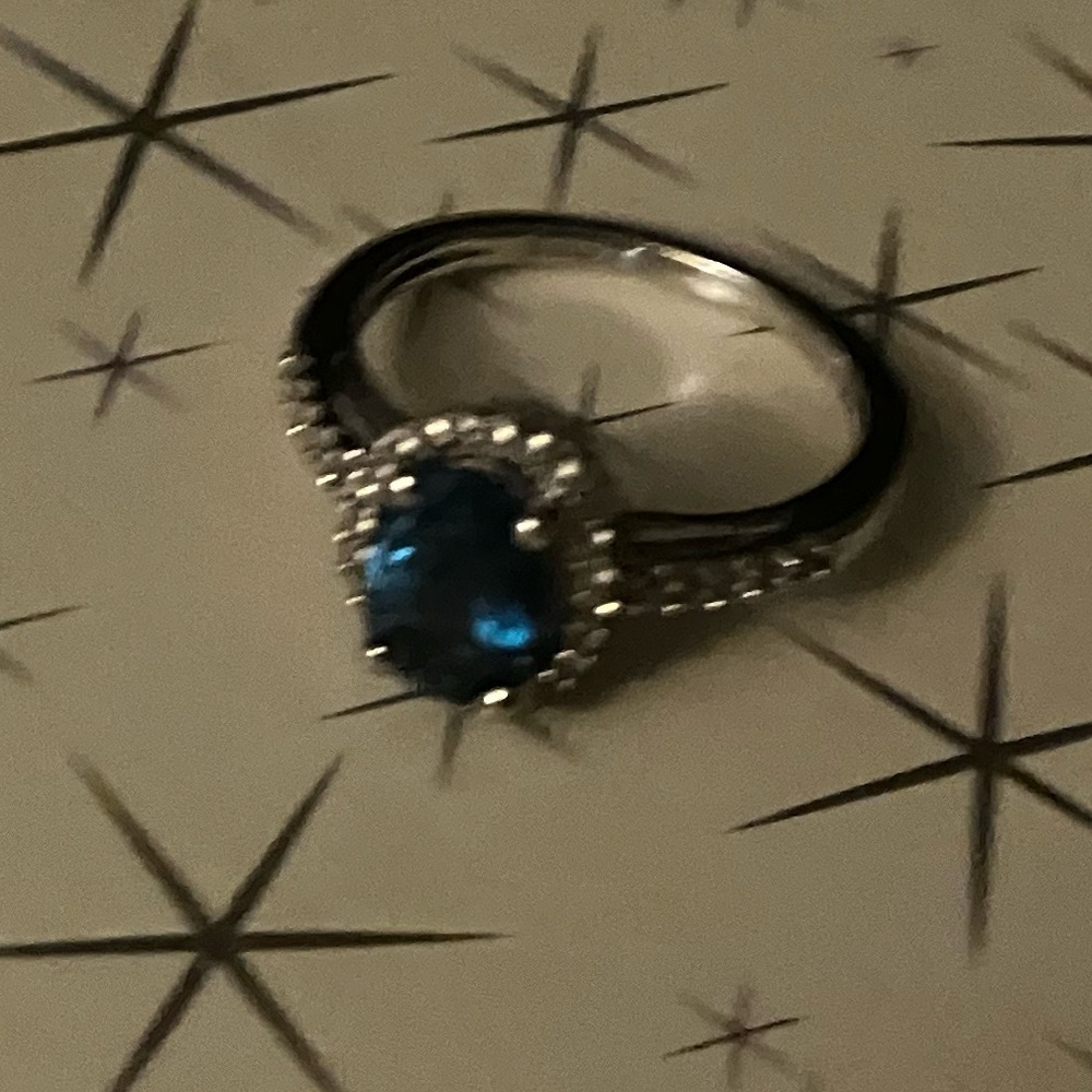 Size 7 white gold or silver not sure color blue